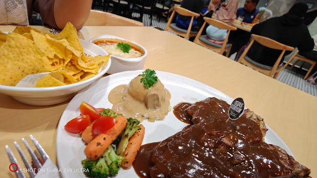 Opinii despre Texas Station Cafe & Restaurant în Chukai - Gastronomi dan perhotelan